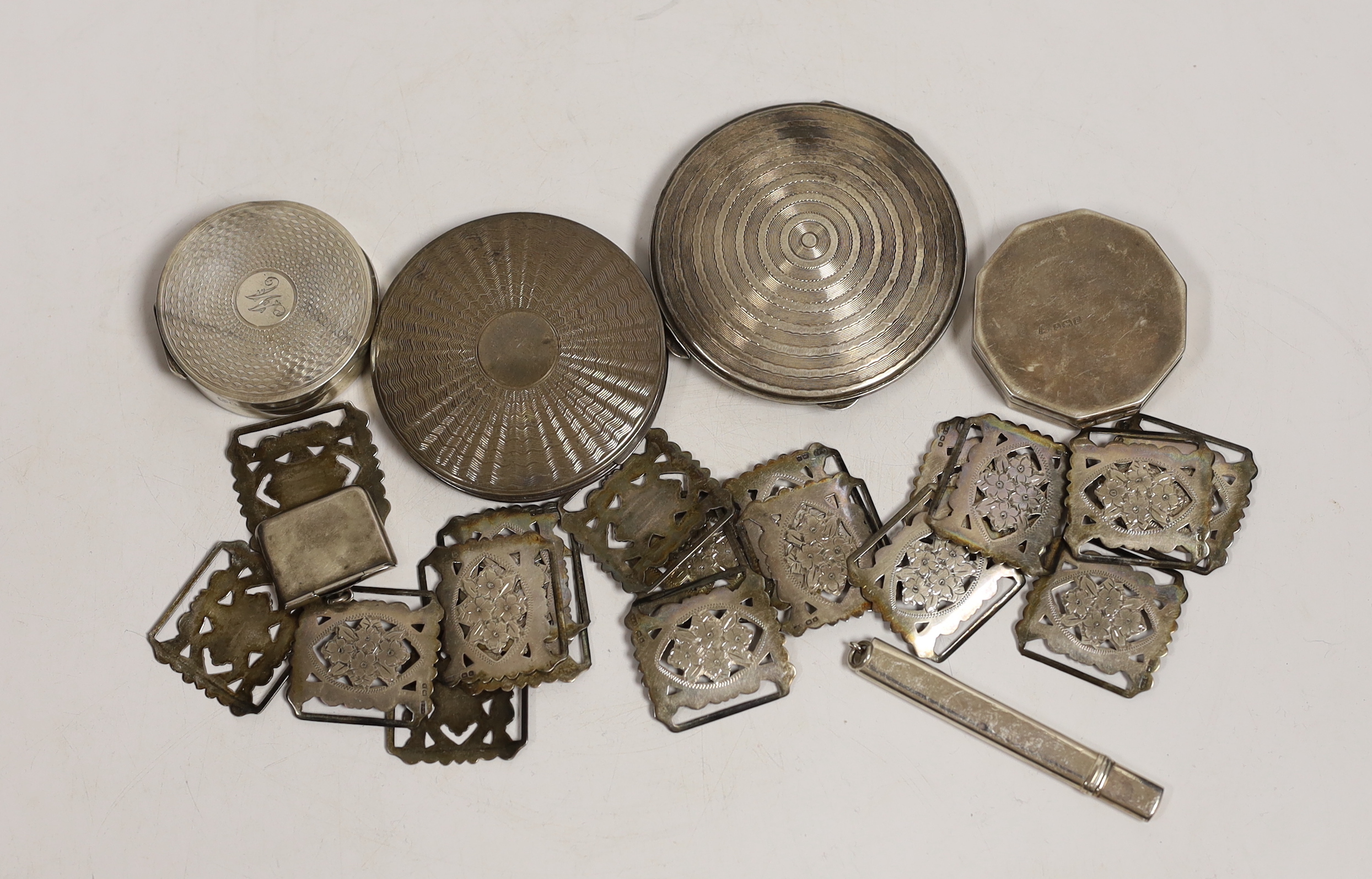 A George V silver envelope stamp case, Crisford & Norris, Birmingham, 1912, 29mm, eighteen early 20th century pierced silver belt links, four assorted silver compacts and a silver pencil holder.